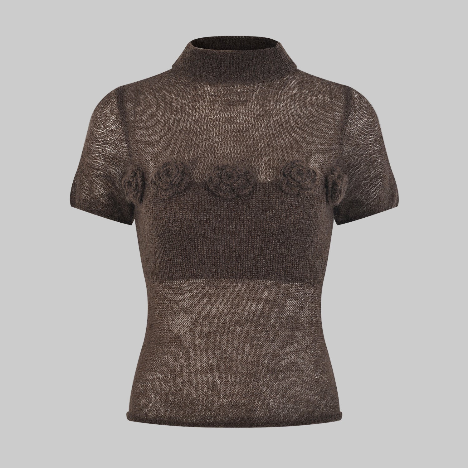 Brown knit top with floral embellishments on a gray background
