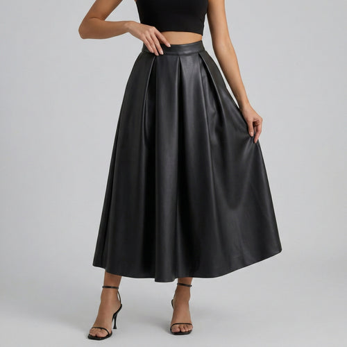 Black leather skirt worn by a model on a gray background