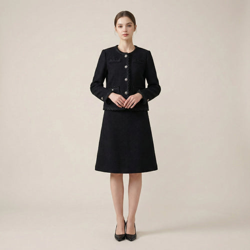 Woman wearing a black coat and skirt set on a beige background