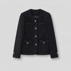 Black jacket with decorative buttons on a light gray background