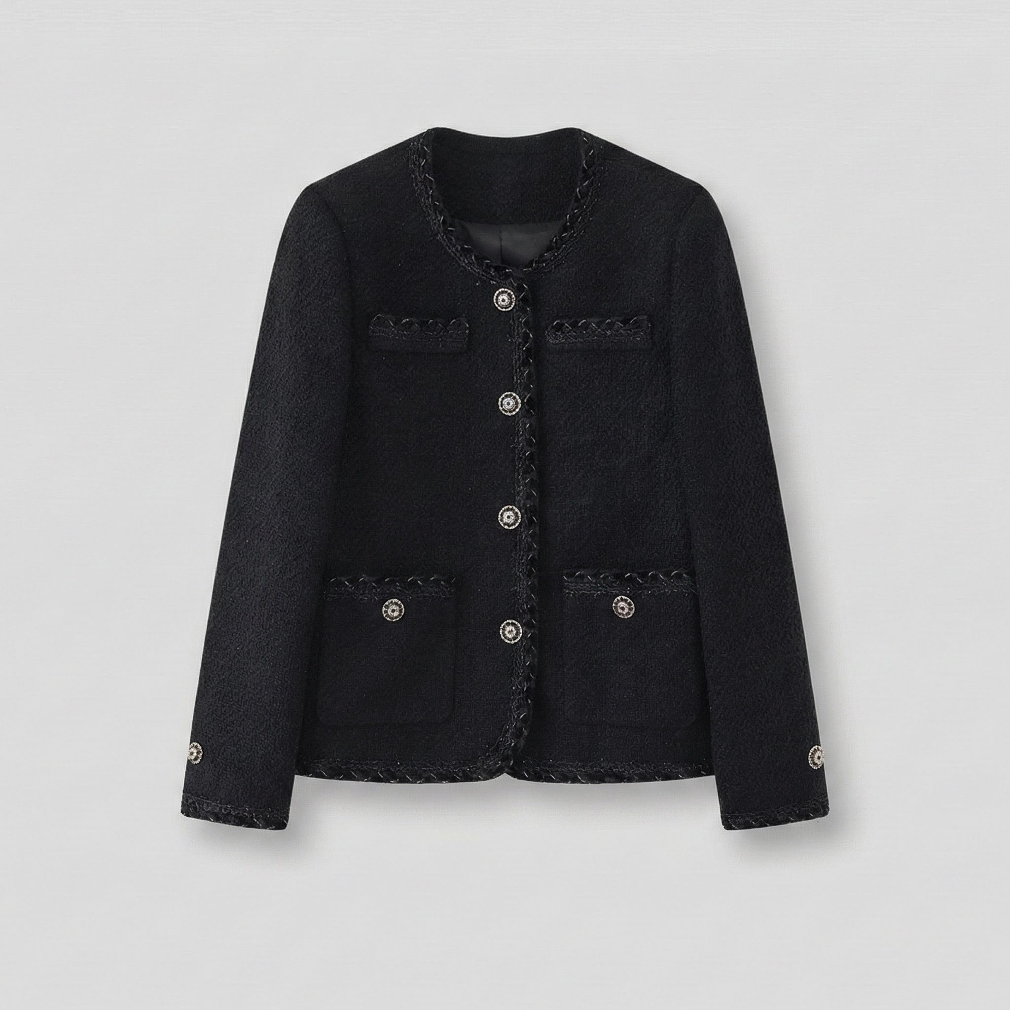 Black jacket with decorative buttons on a light gray background