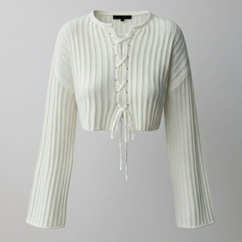 White ribbed knit cardigan with long sleeves on a gray background