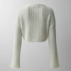 Light green ribbed knit shrug on a light gray background