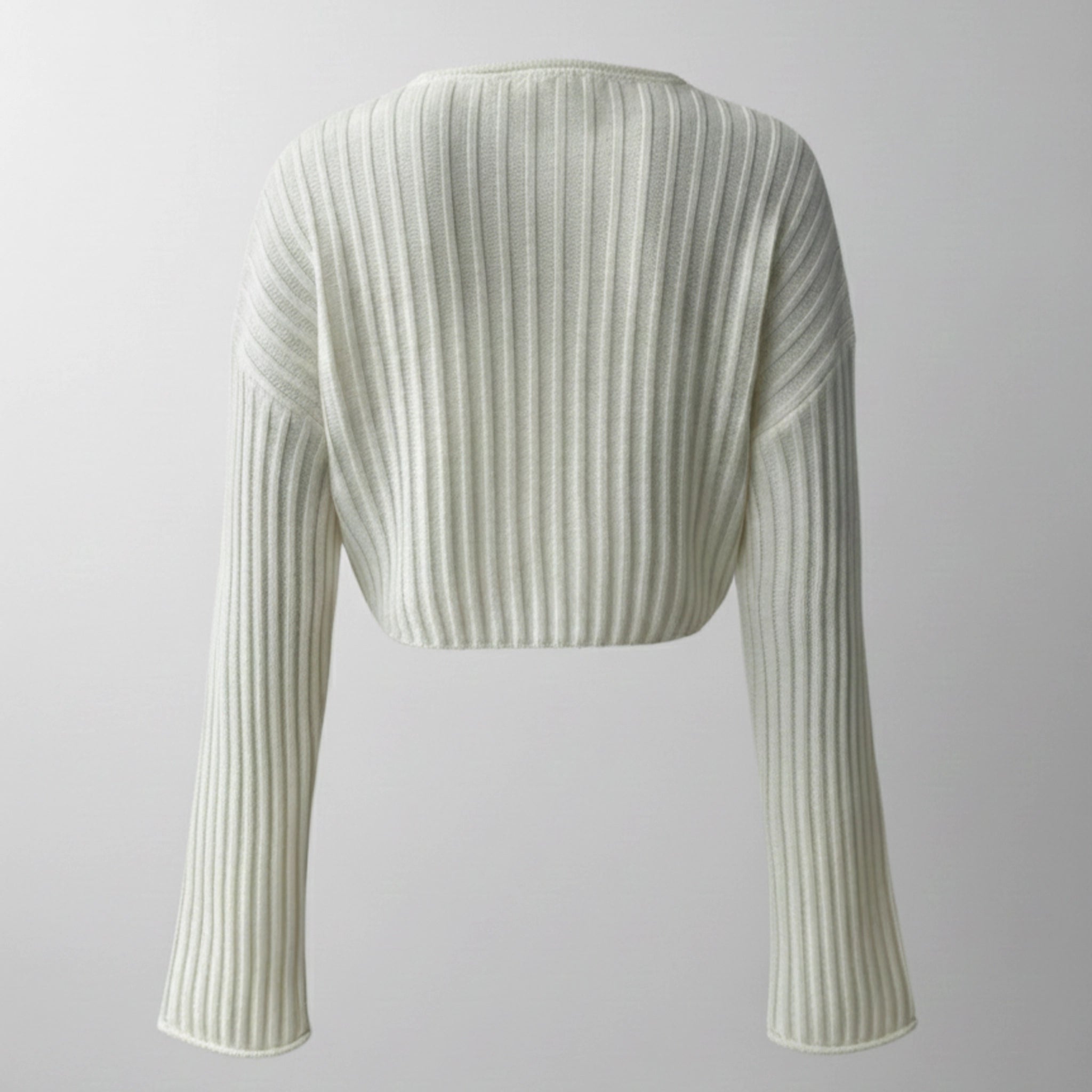 Light green ribbed knit shrug on a light gray background
