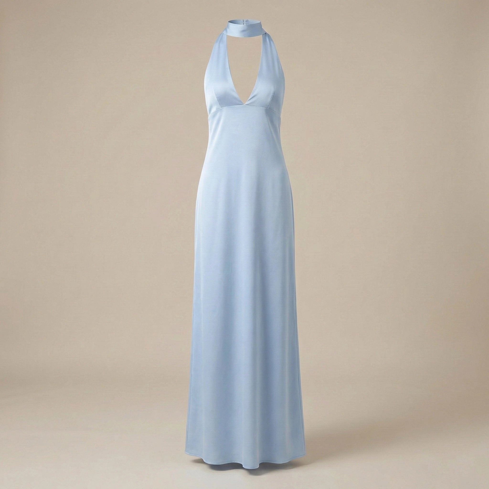 Light blue halter neck gown on a beige background