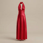 Red halter neck gown on a beige background