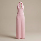 Pink halter neck gown on a beige background