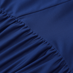 Close-up of a blue fabric with pleated texture