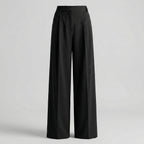 Black wide-leg pants on a light gray background