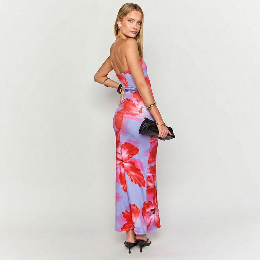 Woman wearing a floral dress with a plain background