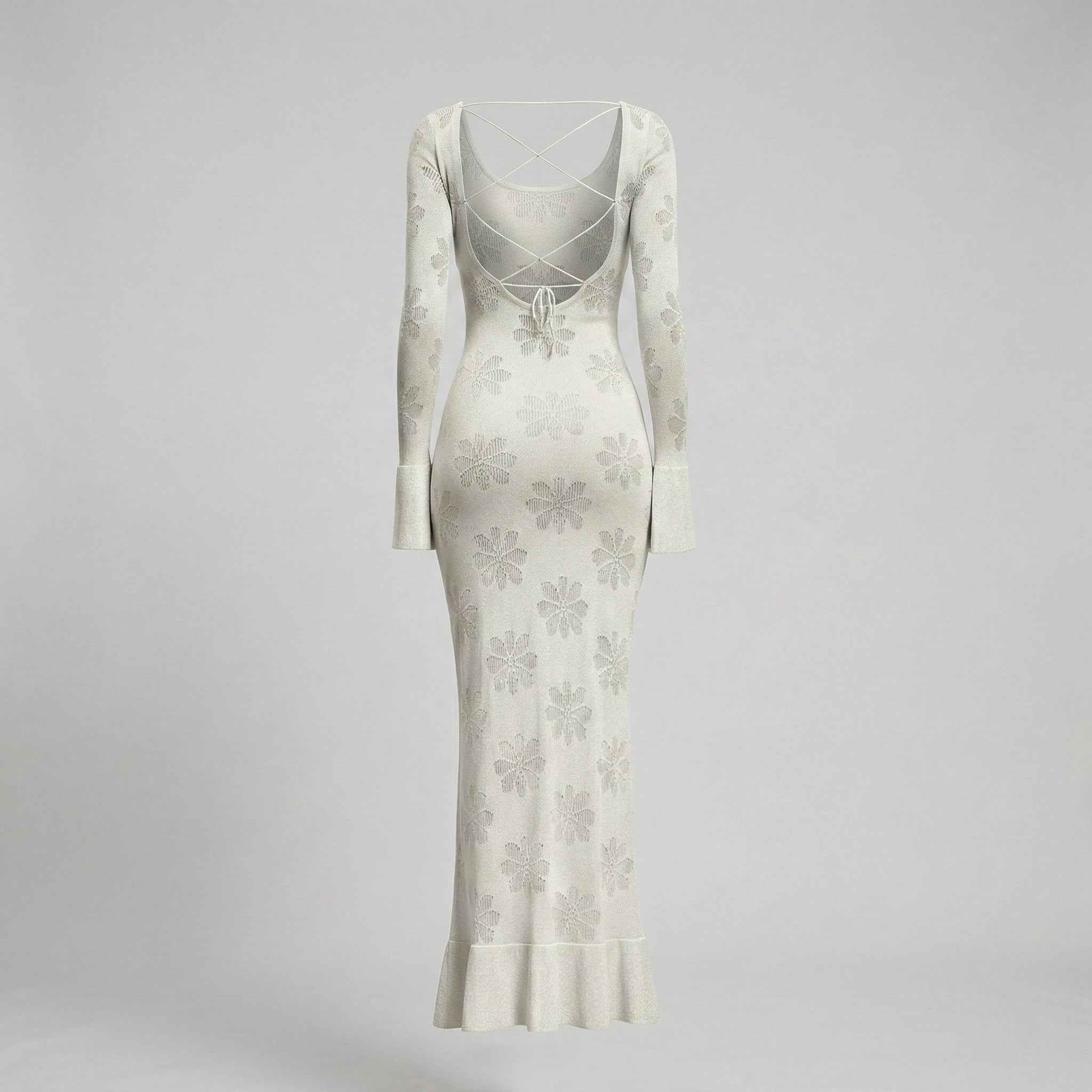 White floral dress with long sleeves on a gray background