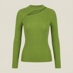 Green ribbed sweater on a beige background