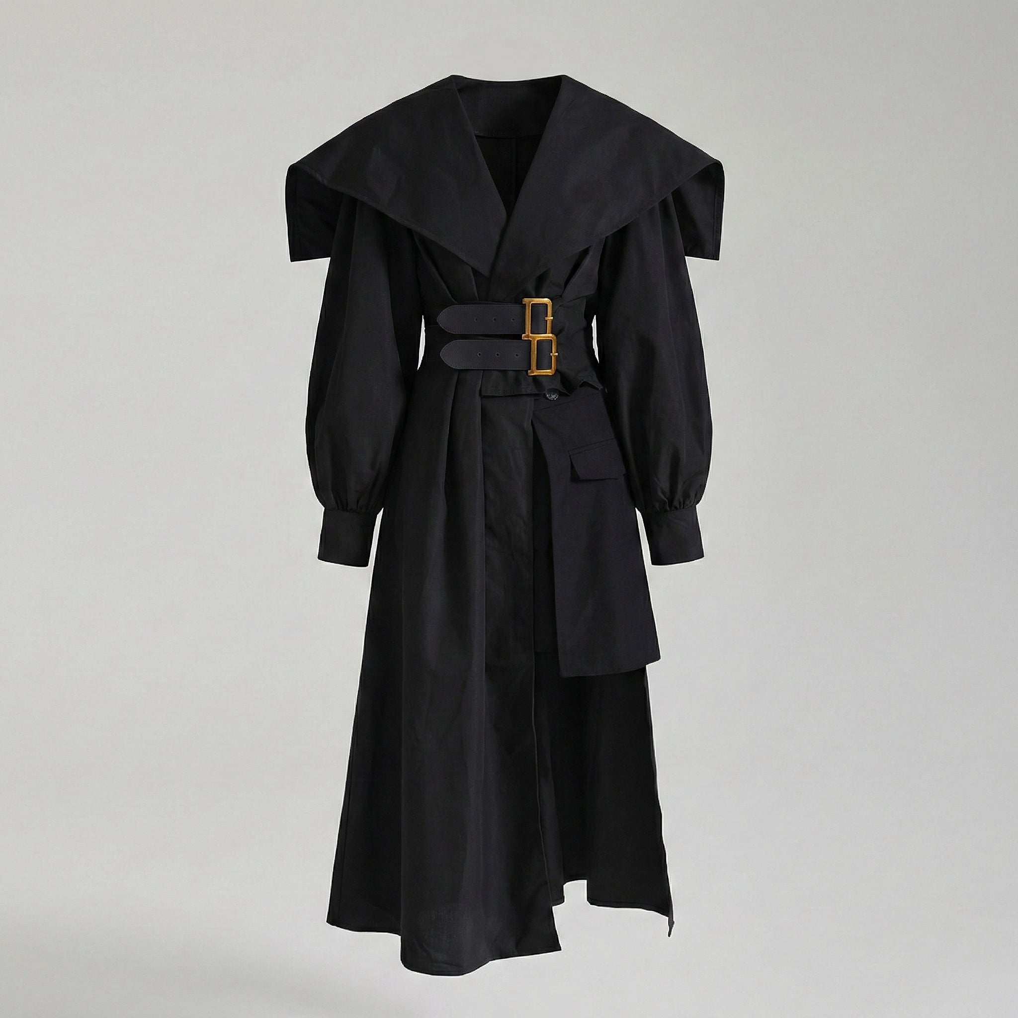 Black coat with a gold buckle on a light gray background