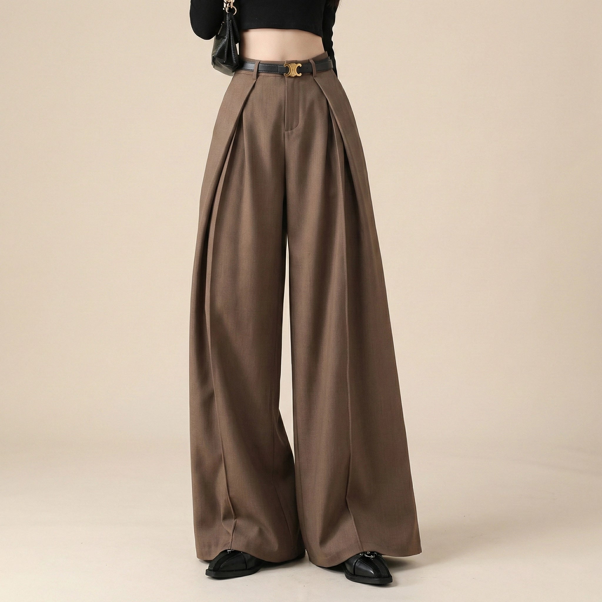Brown wide-leg pants with a belt on a beige background