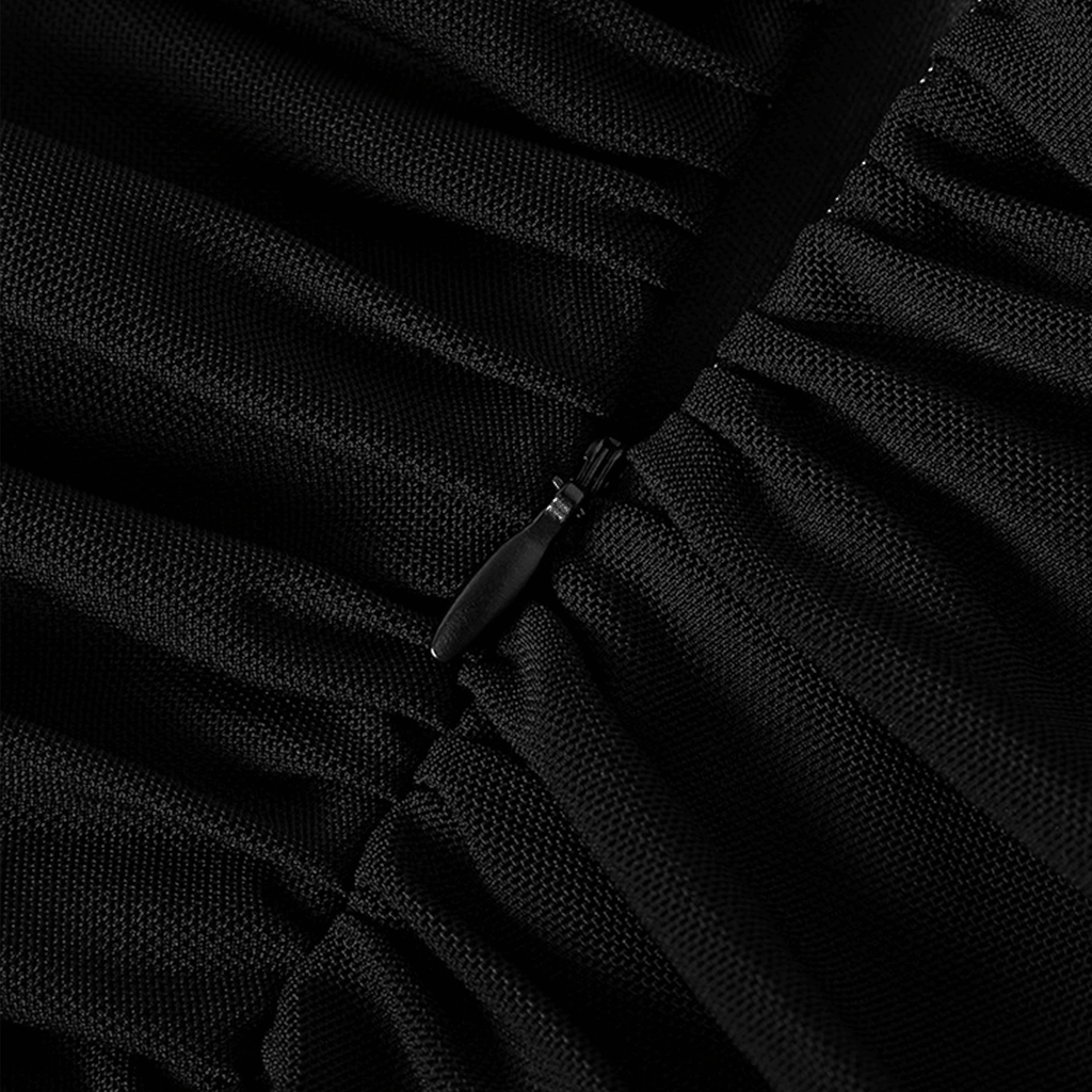 Close-up of a black dress with a zipper detail