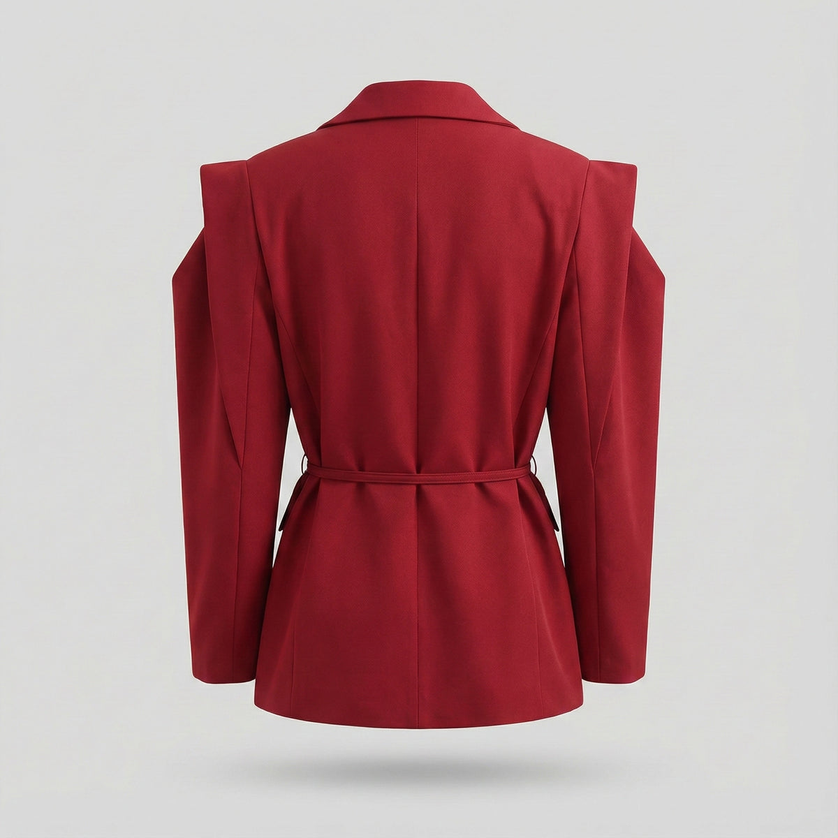 Red blazer with shoulder cutouts on a light gray background