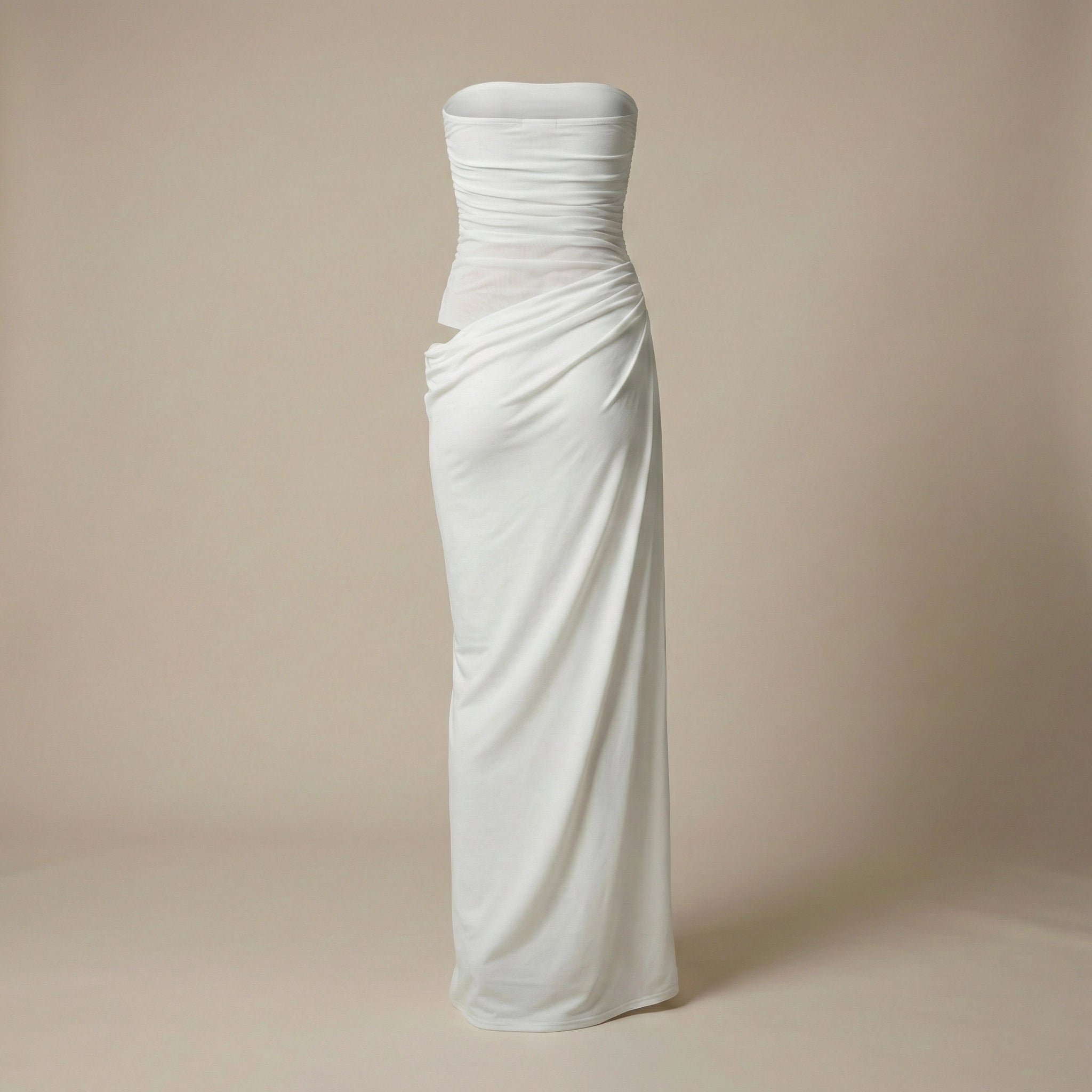 White strapless gown on a beige background