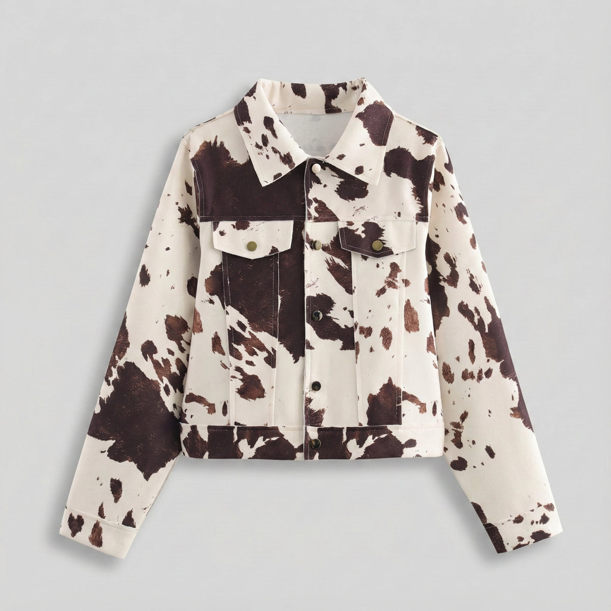 Cow print jacket on a light gray background