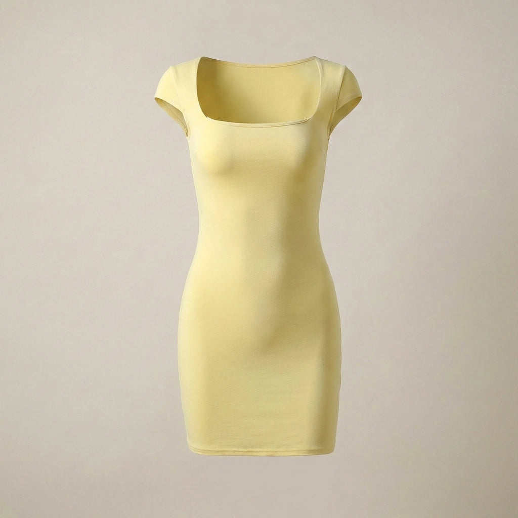 Yellow dress on a beige background