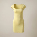 Yellow dress on a beige background