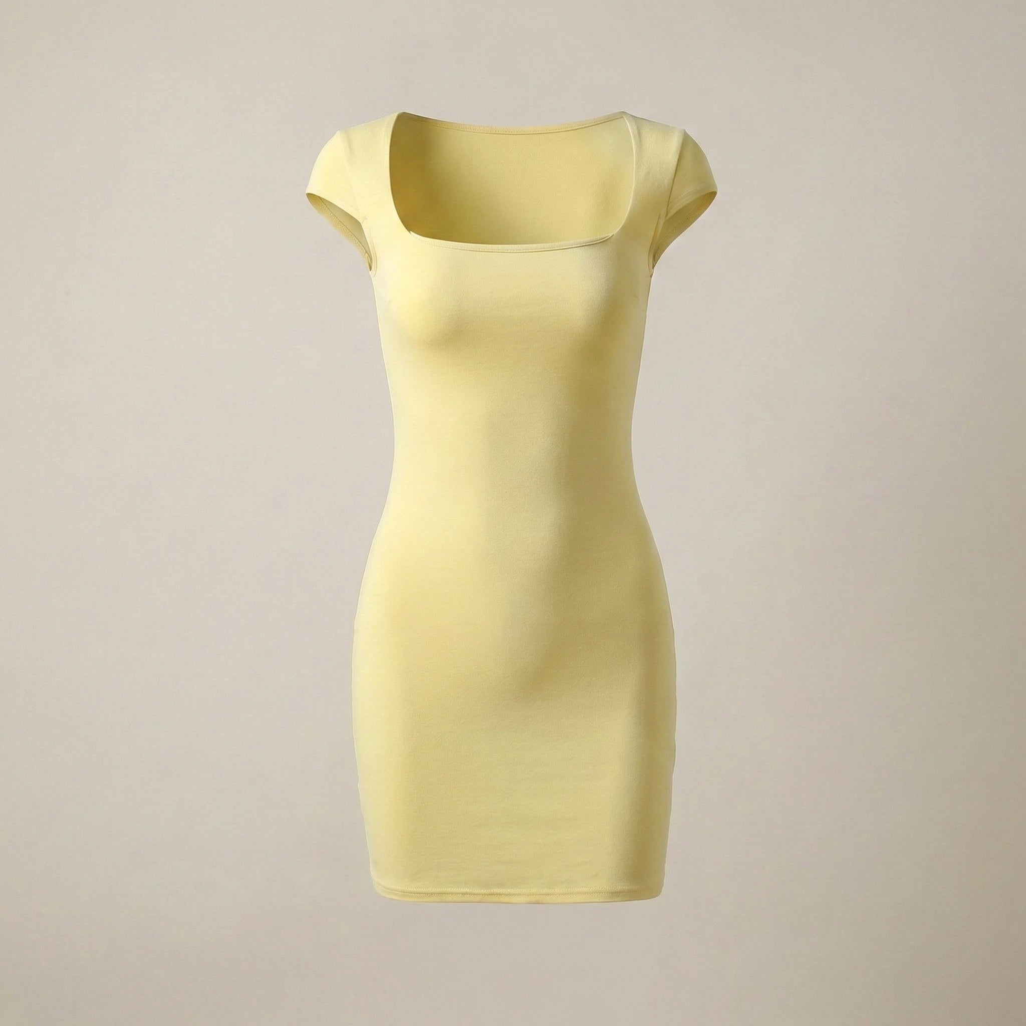 Yellow dress on a beige background