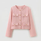 Pink jacket with gold buttons on a light gray background