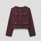 Maroon jacket with button details on a light gray background