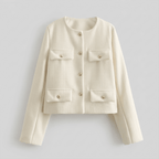 White jacket with gold buttons on a light gray background