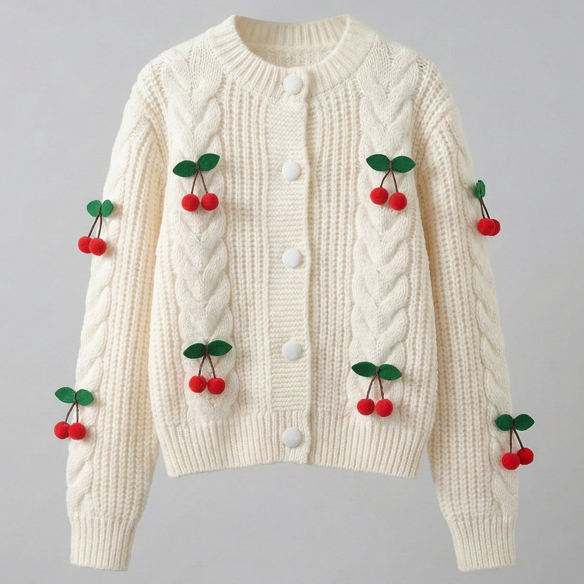 Cream-colored sweater with cherry decorations on a gray background