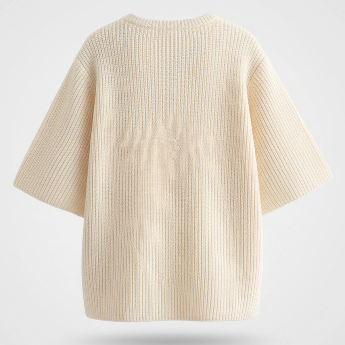 Beige ribbed knit sweater on a light gray background