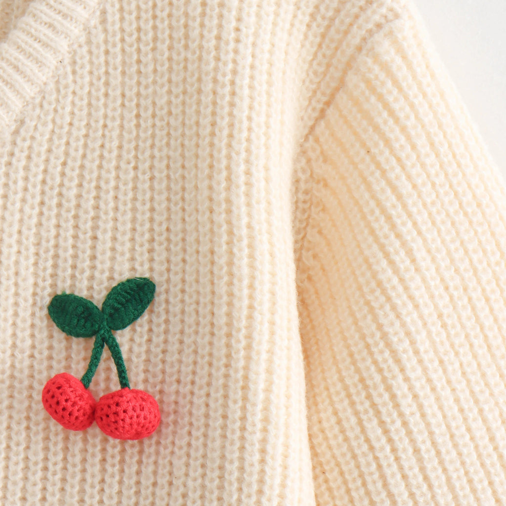Embroidered cherries on a beige knitted fabric
