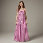 Woman wearing a pink strapless dress with intricate patterns on a neutral background