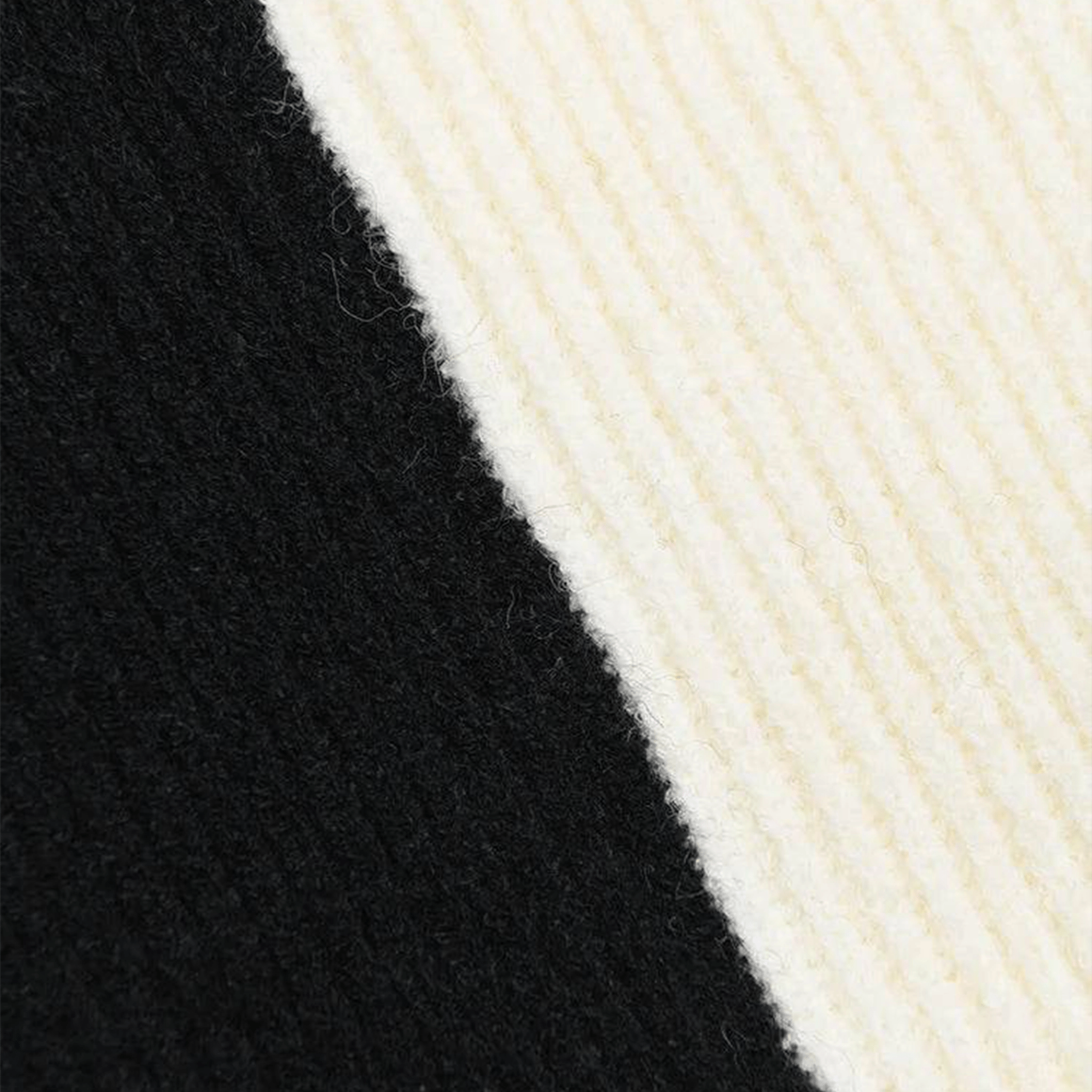 Close-up of black and white yarn textures