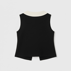 Black sleeveless top with a white collar on a light gray background