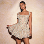 Woman wearing a floral dress against a beige background