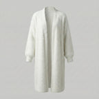 White cardigan on a light gray background