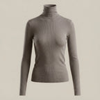 Gray turtleneck sweater on a beige background