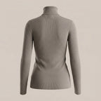 Gray turtleneck sweater on a beige background