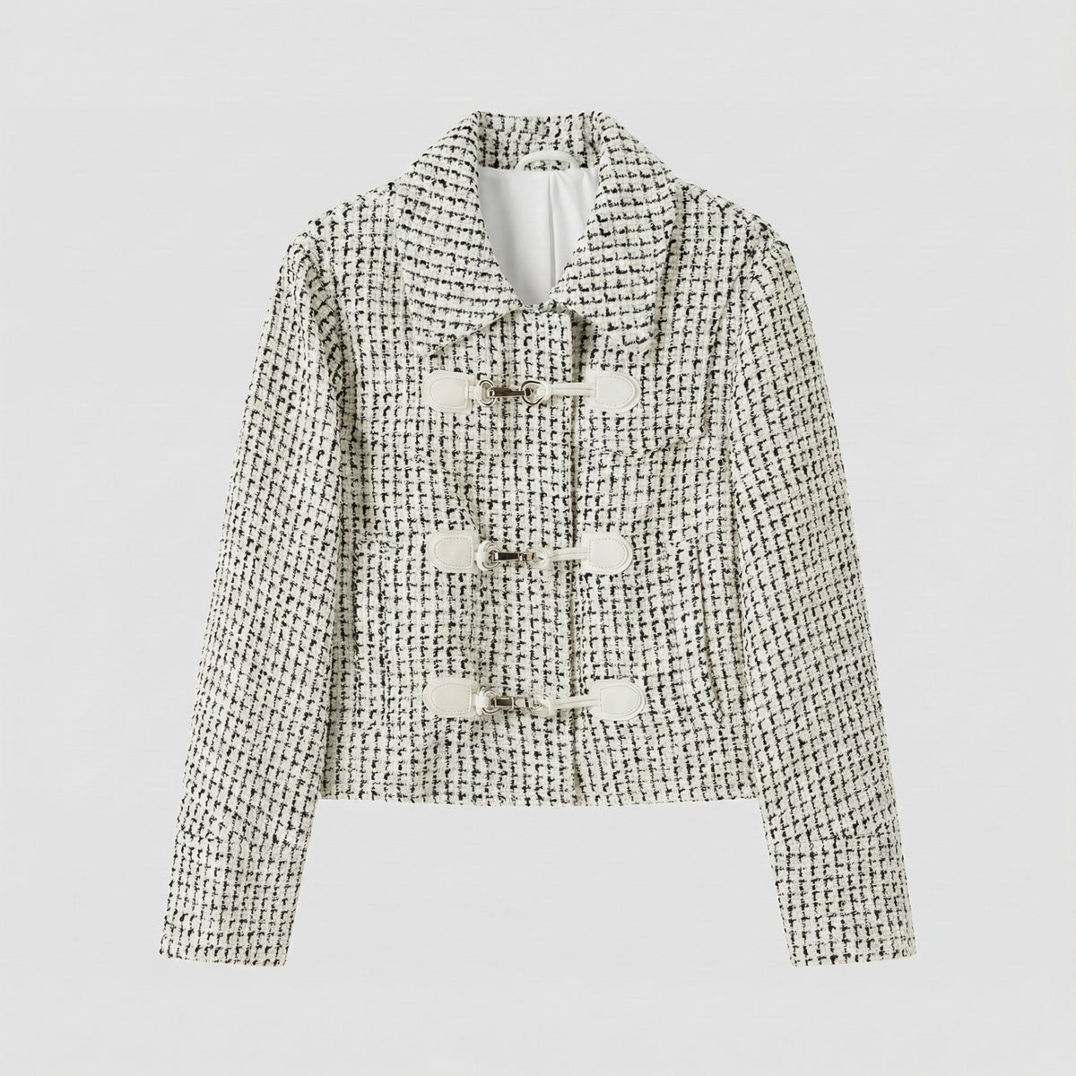 Textured jacket with button details on a light gray background