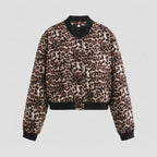 Leopard print jacket with black trim on a light gray background