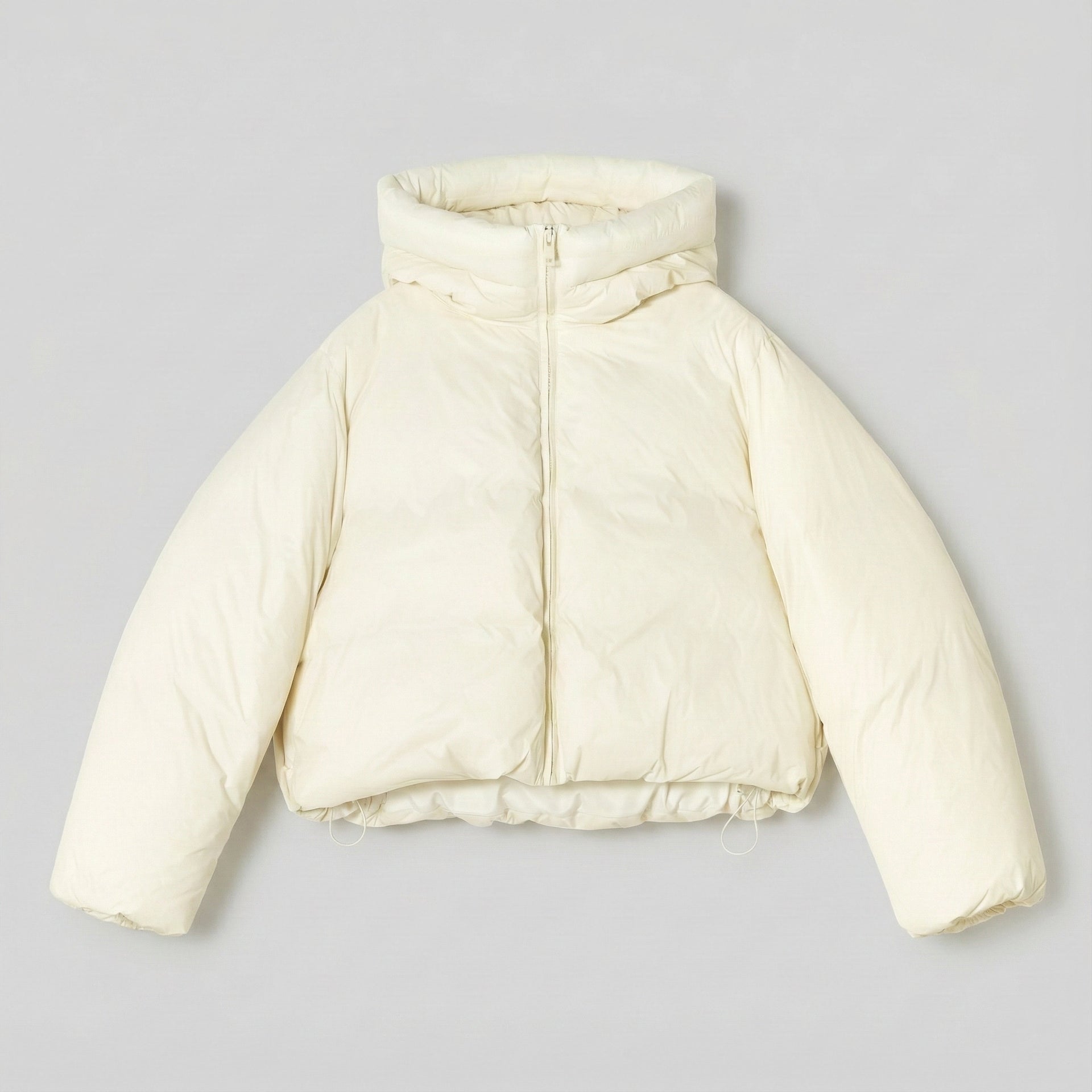 White puffer jacket on a light gray background