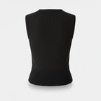Black sleeveless sweater on a light gray background