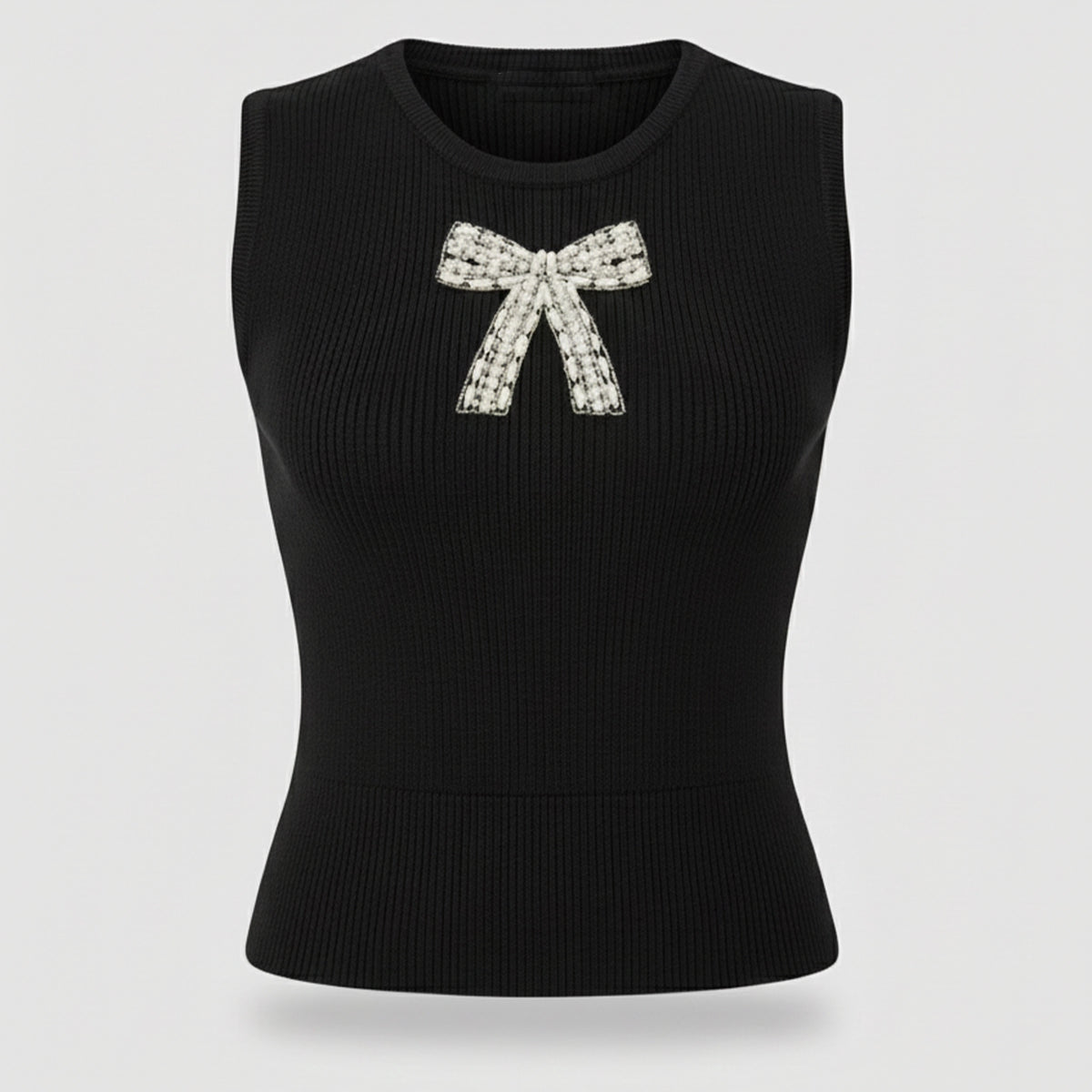 Black sleeveless top with a decorative bow on a light gray background