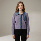 Woman wearing a purple denim jacket with a neutral background