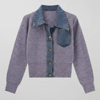 Purple cardigan with denim collar and pocket on a light gray background