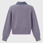 Purple sweater with denim collar on a light gray background