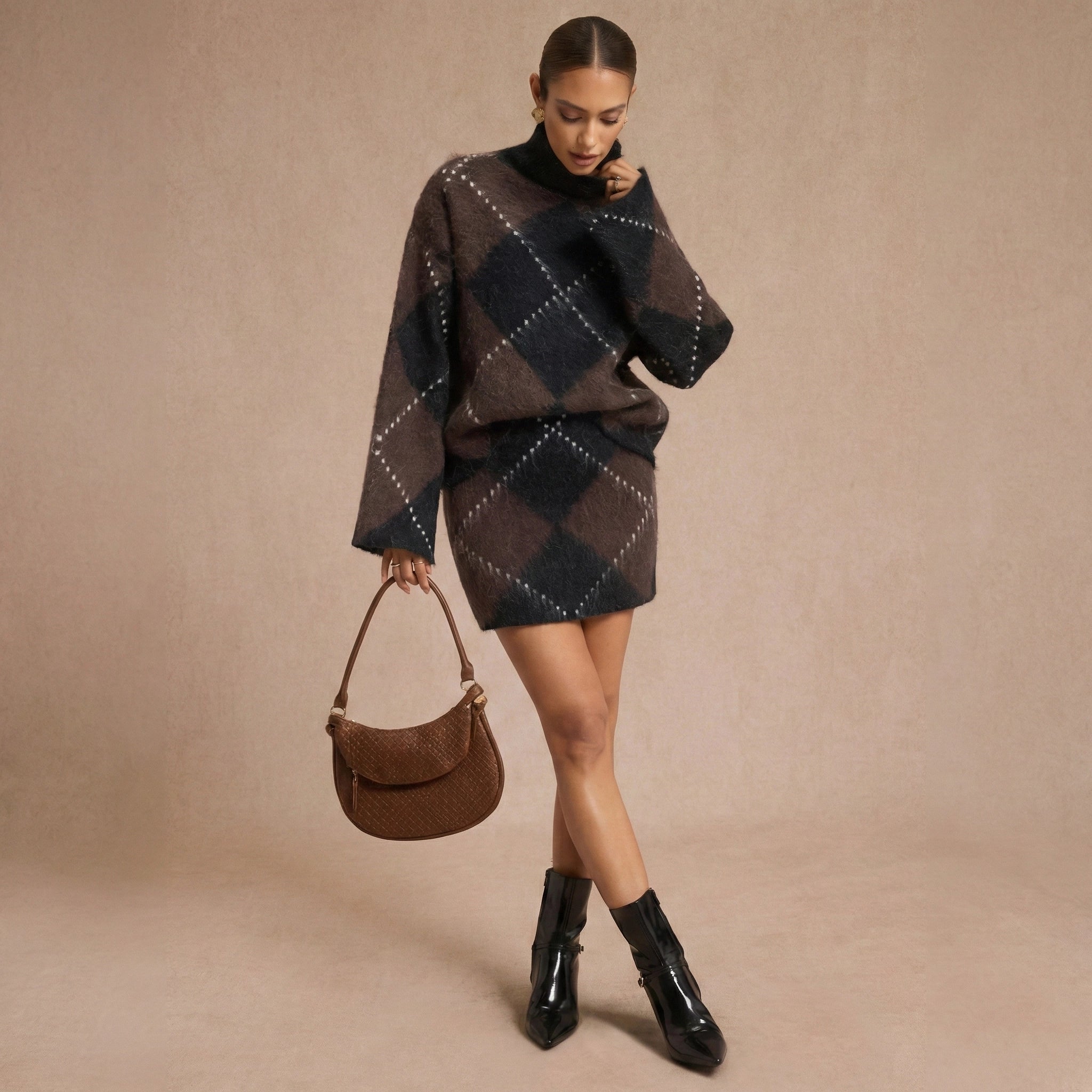 Woman wearing a patterned sweater and skirt set with a brown handbag on a beige background
