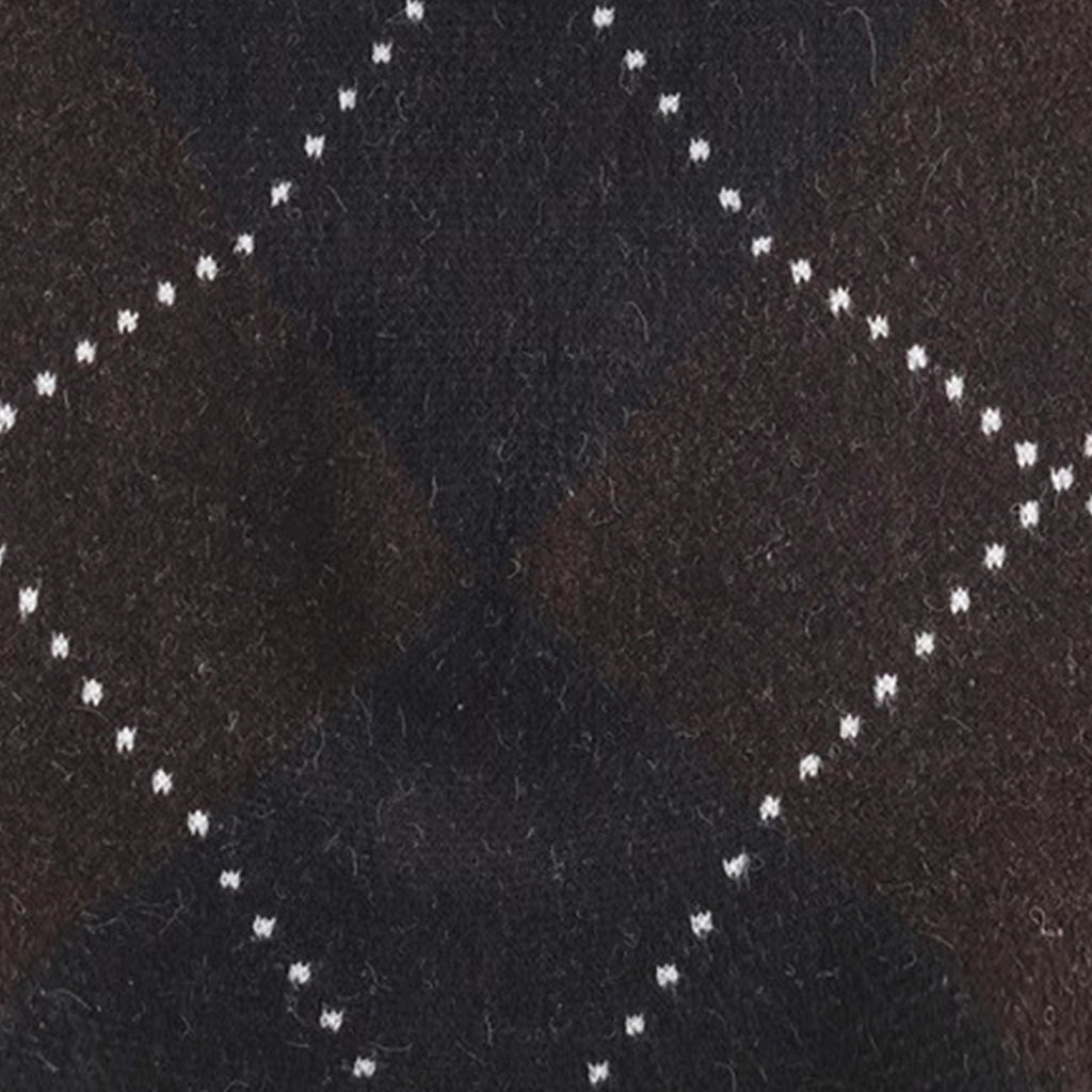 Close-up of a textured black fabric with white stitching pattern