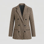 Plaid coat with black buttons on a light gray background