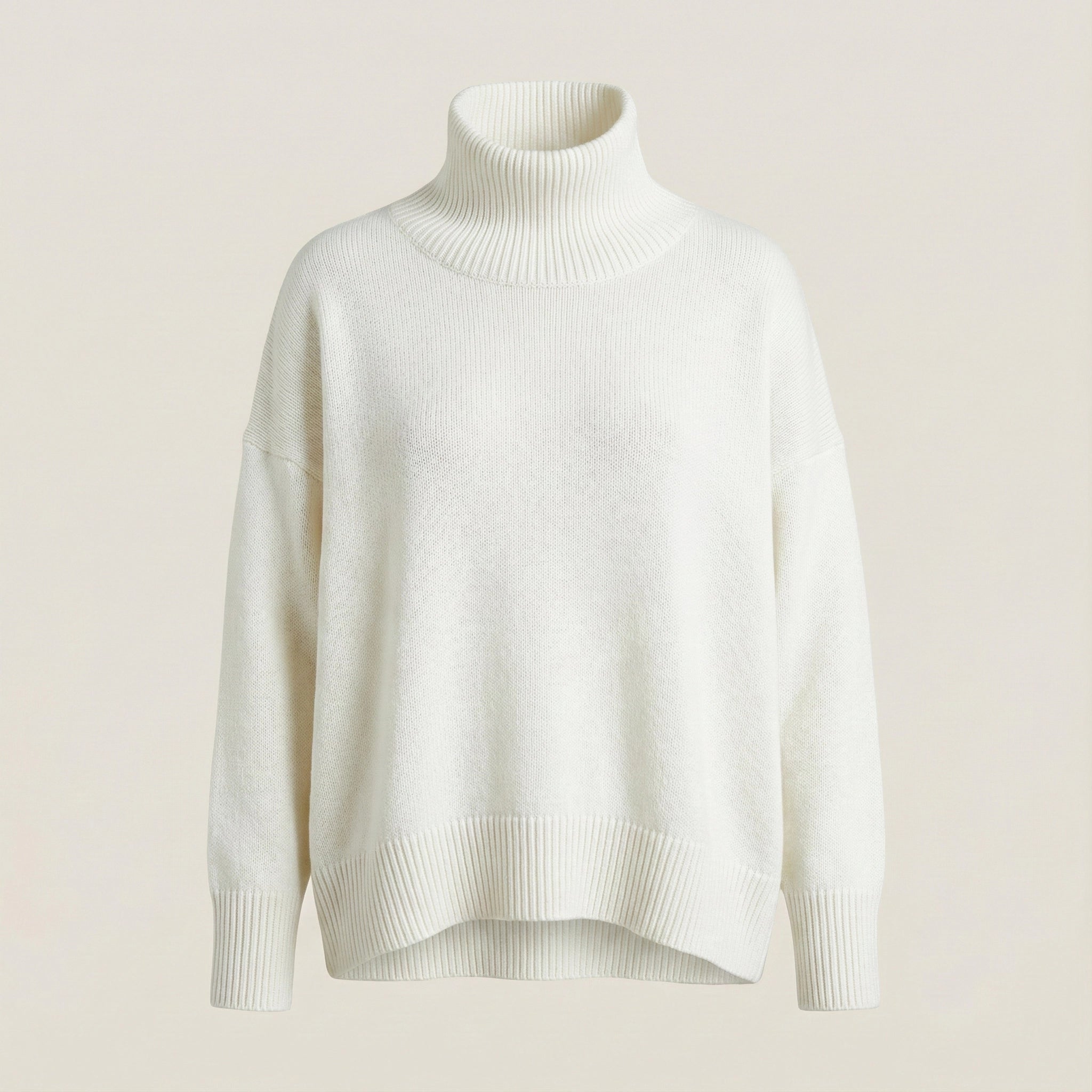 White turtleneck sweater on a light beige background
